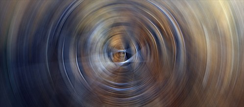 Horizontal abstract background featuring dark soft circles with circular glow lights rings in blue