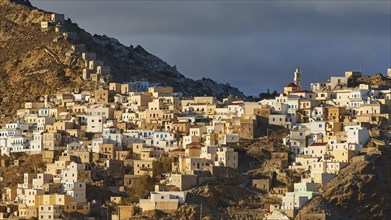 A traditional mountain village glows in the golden sunlight and conveys a Mediterranean atmosphere,