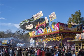 Crowd of people on fairground, amusement park, amusement ride, fairground rides, at the traditional