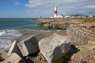 Red and white lighthouse on the coast at Portland Bill, isle of Portland, Dorset, England, United