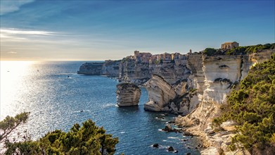 Picturesque coastal town of Bonifacio with its limestone cliffs overlooking the sunlit sea in