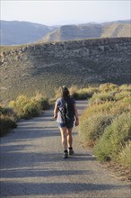 Woman walking Rodalquilar, Cabo de Gata natural park, Almeria, Spain, Europe