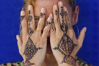 Woman with traditional Moroccan hand tattoo, henna, tattoo, craft, tradition, traditional,