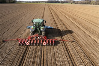 Sugar beet being sown in spring, precision sowing with precision seed drill, behind a tractor,