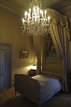 Chandelier and canopy bed in the Marquise's apartment at Kasteel van Gaasbeek, renovated medieval