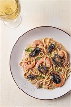 Spaghetti, pasta, with seafood, shrimp with mussels, in creamy garlic sauce, homemade, no people