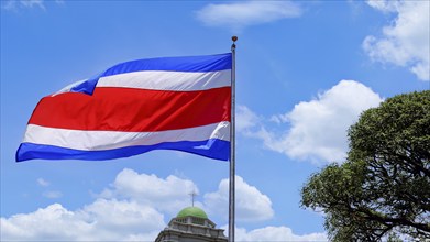 Costa Rica Flag proudly waving in San Jose. Large Costa Rica flag is flying high in city center