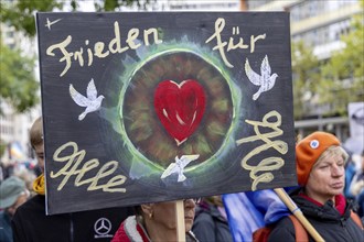 Peace for all sign at the Lay down your arms demonstration on Breitscheidplatz in Berlin. The event