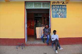 Aksum, Axum, owners sitting in front of their shop, Ethiopia, Africa