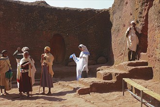 Rock churches of Lalibela, pilgrims in front of the entrance to Bete Maskal, Chapel of the Cross,