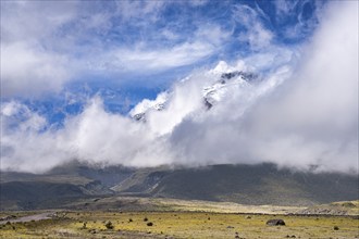 Cloud-shrouded Cotopaxi volcano, Cotopaxi, Cotopaxi National Park, Latacunga, Ecuador, South