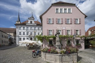 Baroque town hall, inaugurated in 1716, in front Goldene Krone inn with Marienbrunnen fountain,