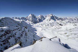 Mountain panorama with snow-covered mountain landscape in winter, view of mountain peaks