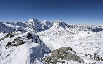 Mountain panorama with snow-covered mountain landscape in winter, view of mountain peaks