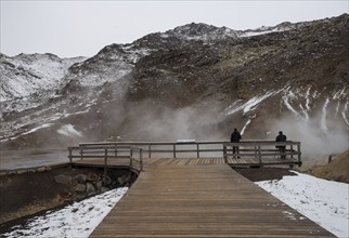 Unrecognized people watching the Gunnuhver Geothermal field at Reykjanes Peninsula in the island of