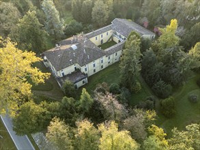 Aerial view of the sant'agata villa, the house of giuseppe verdi, surrounded by colorful autumn