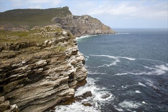 Rocky coast at the Cape of Good Hope with cliffs of rock layers