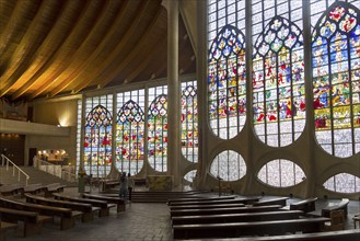 Rouen, France, August 30, 2018: Old Renaissance stained glass windows in a modern catholic church