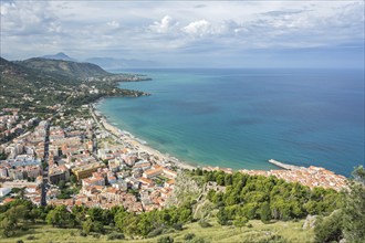 Panoramic shot of picturesque fishing village and vacation spot (Cefalu) on scenic bay with