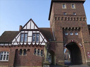 Historic building with half-timbering and archway in brick, coesfeld, münsterland, germany