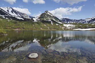 Summer mountain landscape of Kamchatka Peninsula: view of Mountain Range Vachkazhets, lake and