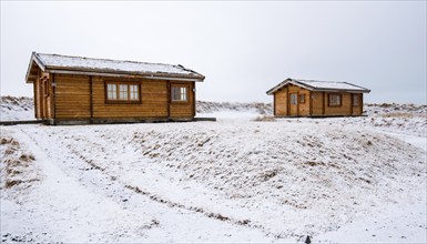 Wooden holiday chalet in winter at Snaefellsnes peninsula in Iceland