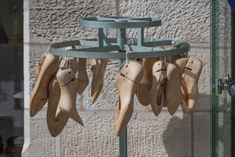 Shoe lasts on a stand in front of a shoemaker's shop, Iphofen, Lower Franconia, Bavaria, Germany,