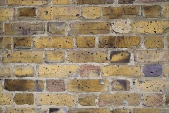 Weathered yellow brick wall, Kew, London, England, Great Britain