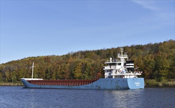 Cargo ship Nordborg sails through the Kiel Canal in autumn, Kiel Canal, Schleswig-Holstein,