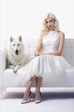 Beautiful young woman with blond hair seated on a sofa with her pet white wolf, AI generated