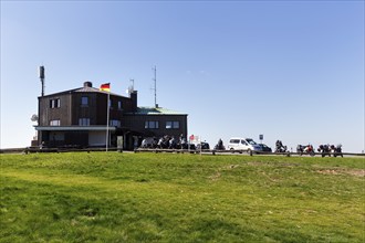 Restaurant and café, motorbikes in car park, Köterberghaus, mountain peak, sunny spring weather,