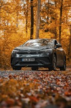 VW ID.4 in an autumnal forest with orange leaves on the ground, electric car, VW ID 5, Gechingen,