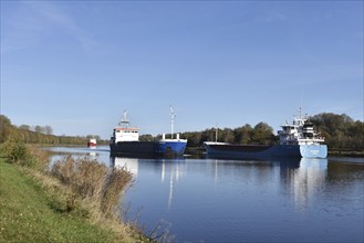 Cargo ship Nordborg sails through the Kiel Canal in autumn, Kiel Canal, Schleswig-Holstein,