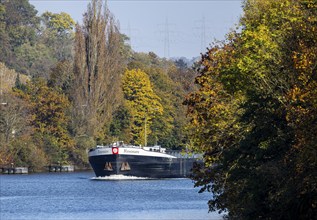 Barge RESONARE underway on the Neckar, vineyards in autumn. The barge has an overall length of 105