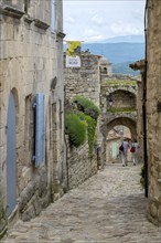 Medieval alley in the village of Lacoste, Vaucluse, Provence Alpes Côte d'Azur, Provence, France,