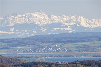 A winter landscape with a snow-covered mountain, Säntis in the Alpsetein, and a village in the