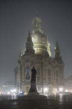 Dresden's old town shrouded in November fog. Church of Our Lady, Foggy atmosphere in Dresden,