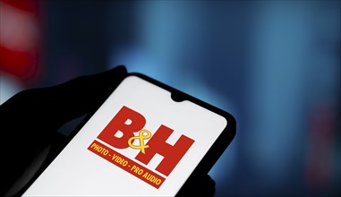 B&H photo logo is displayed on smartphone