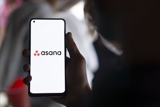 Dhaka, Bangladesh- 09 Nov 2024: Asana logo is displayed on smartphone