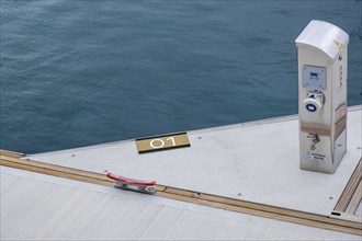 Yacht battery electric charger in a marina. Renewable energy in a dock