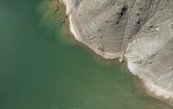 Drone aerial scenery of a toxic lake of an abandoned copper mine. Environmental pollution concept.