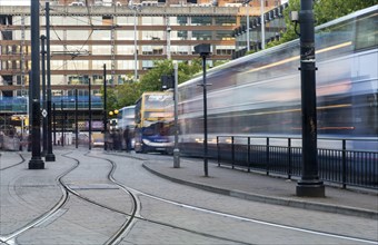 Manchester, England, September 23, 2016: Piccadilly central bus and metro station with moving tram