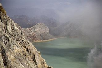 Crater lake in volcano in Southeast Asia with toxic vapours and gases