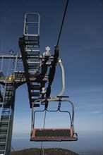 Empty ski lift for transporting skiers at snow slope for skiing in winter