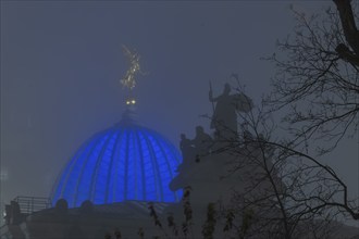 The old town of Dresden shrouded in November fog. Octagon dome with Fama and pediment figures of