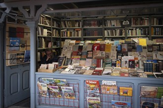 Madrid, Spain, May 2 2024: Bookstore with a variety of vintage books stacked on bookshelf for sale