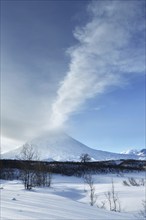 Beauty winterly landscape of Kamchatka: evening view of eruption active Klyuchevskoy Volcano