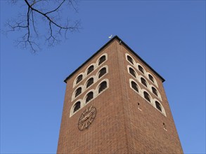 Brick tower with clock and blue sky as background, coesfeld, münsterland, germany