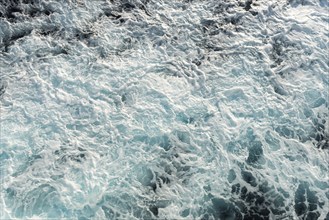 Ocean water surface with waves from a cruise ship wake