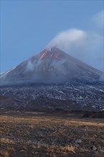 Volcanic landscape of Kamchatka: eruption Klyuchevskoy Volcano, lava flows on slope of volcano,